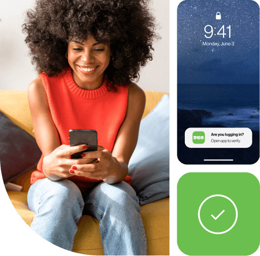 A woman sitting holding their mobile phone getting an authentication message from Duo MFA to securely log into.